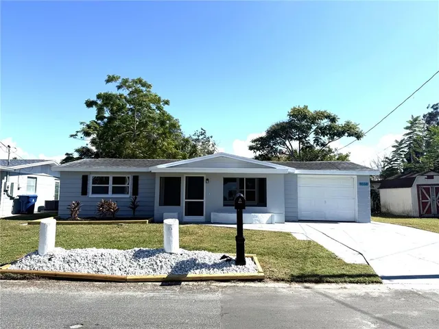 a view of an empty room and a window