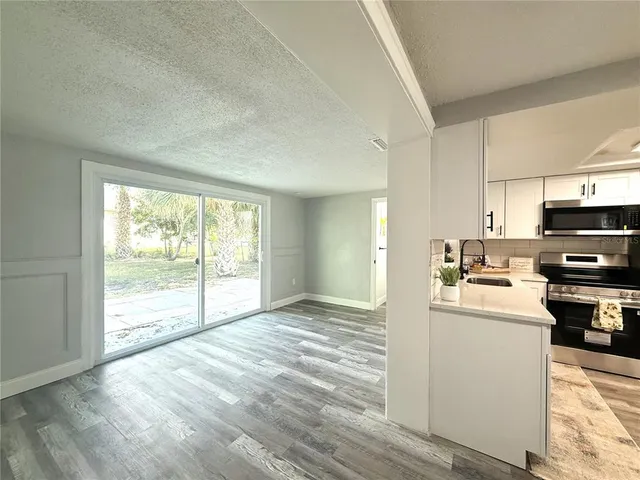 a bathroom with a double vanity sink toilet and mirror