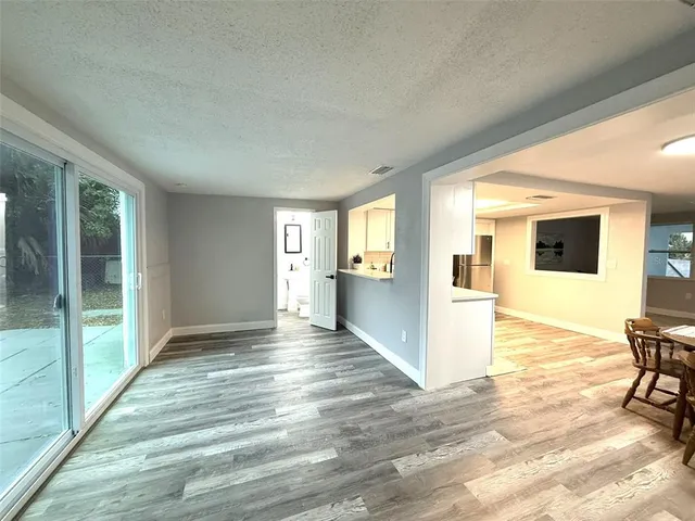 an empty room with furniture and gym equipment