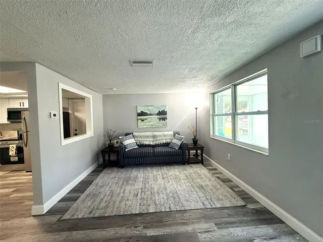 a bed room with a bed and a chandelier