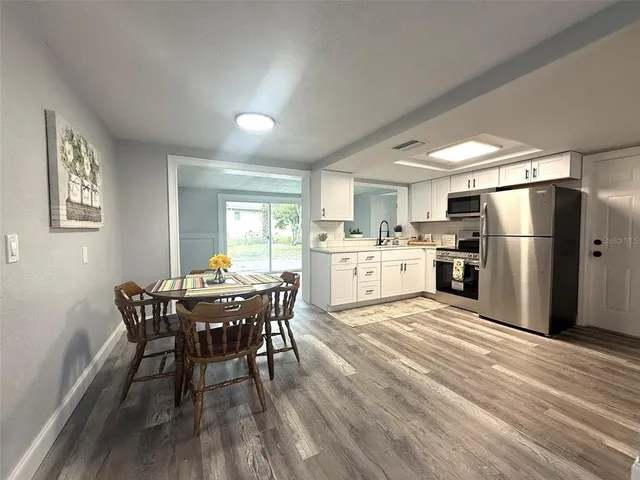 a spacious bedroom with a large bed and a window