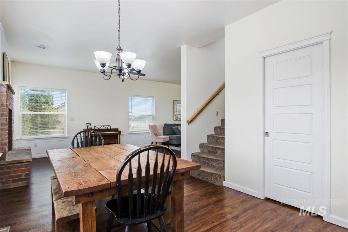 3813 North 2456 East Filer, ID 83328 - Photo 17 of 50 Dining room with dark wood-type flooring and hanging lights