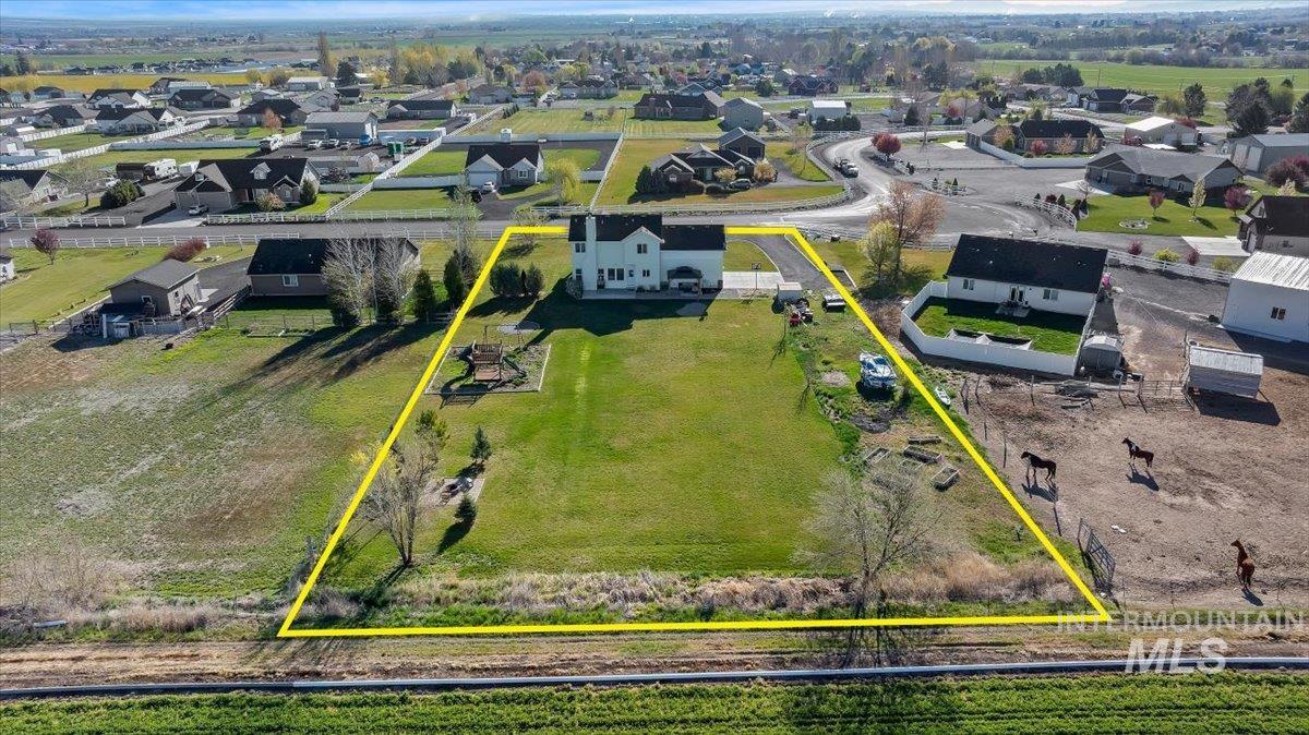 3813 North 2456 East Filer, ID 83328 - Photo 2 of 50 Aerial perspective of suburban area with property boundaries highlighted