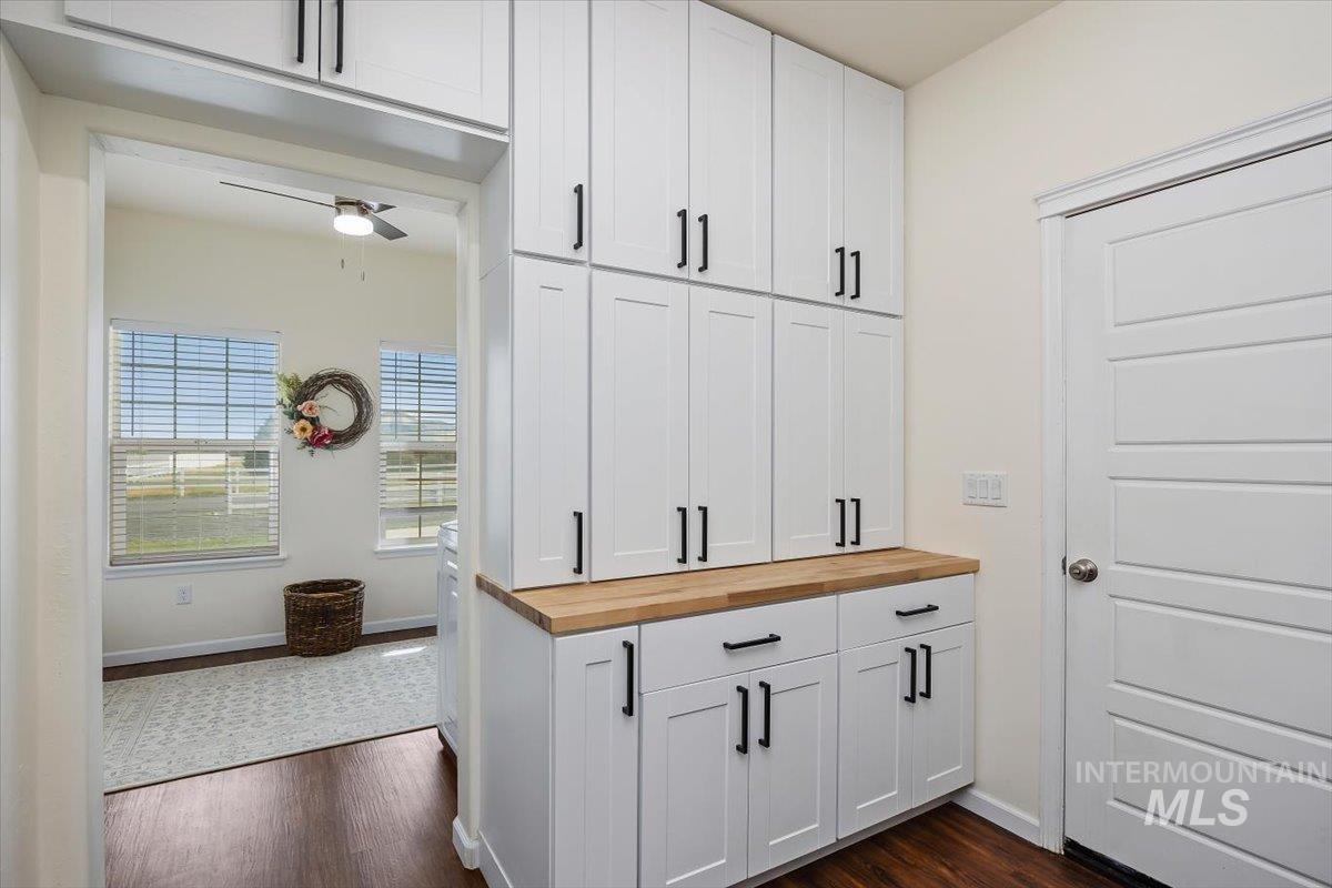 3813 North 2456 East Filer, ID 83328 - Photo 25 of 50 Kitchen featuring wooden counters, white cabinetry, dark wood-type flooring, and ceiling fan