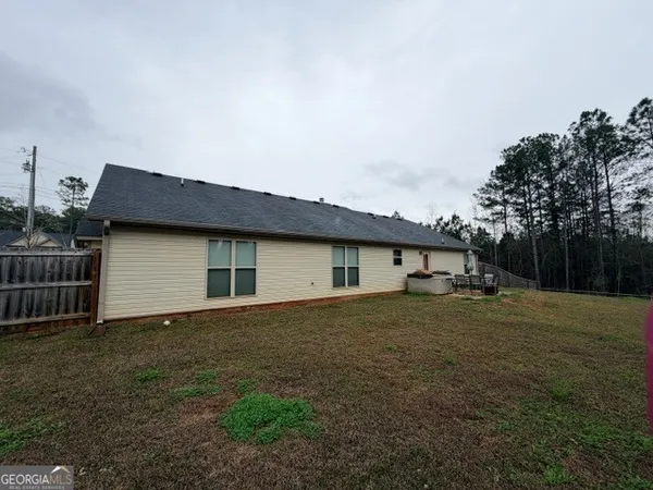a house view with a garden space