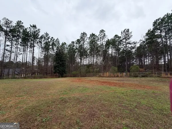 a backyard of a house with trees