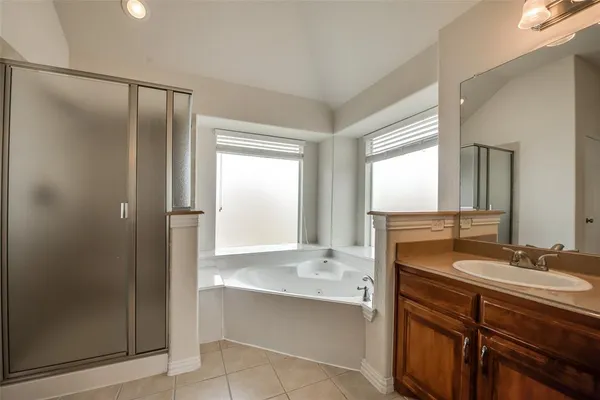 a bathroom with a double vanity sink mirror and double