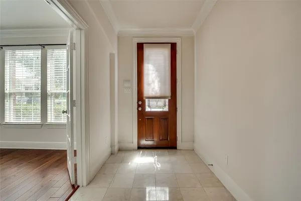 a view of an entryway and a kitchen