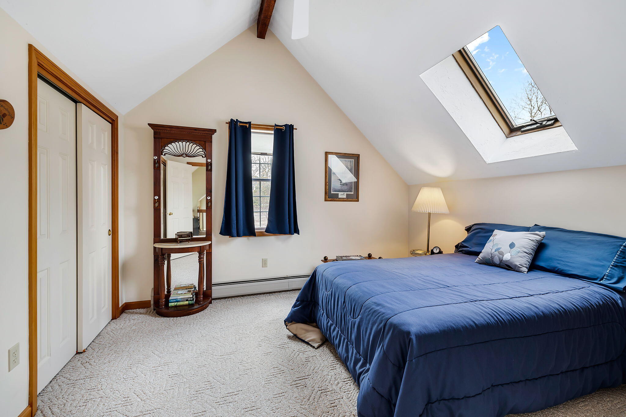 5 Vista Circle Centerville, MA 02632 - Photo 24 of 43 a bedroom with a bed a painting on the wall and a large window