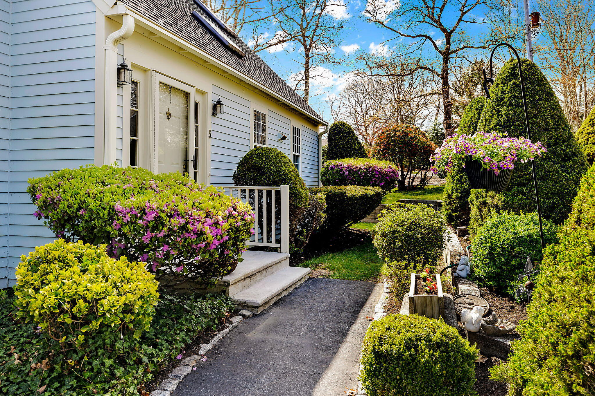 5 Vista Circle Centerville, MA 02632 - Photo 3 of 43 a front view of a house having a garden