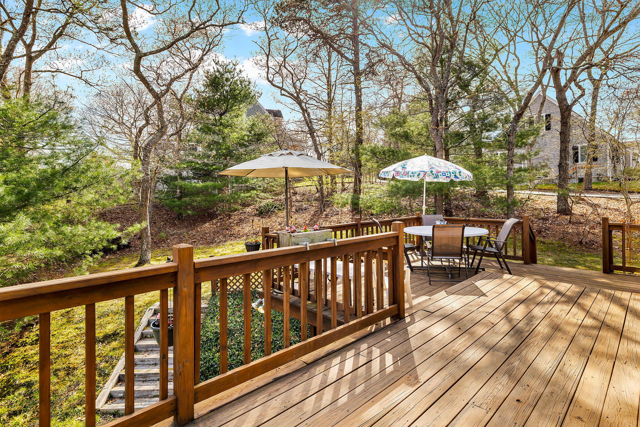 5 Vista Circle Centerville, MA 02632 - Photo 32 of 43 a view of a balcony with chairs and wooden floor