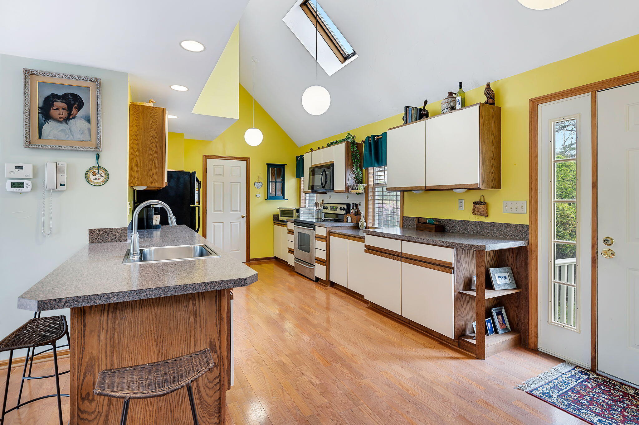 5 Vista Circle Centerville, MA 02632 - Photo 6 of 43 a kitchen with stainless steel appliances granite countertop a sink a stove and a refrigerator