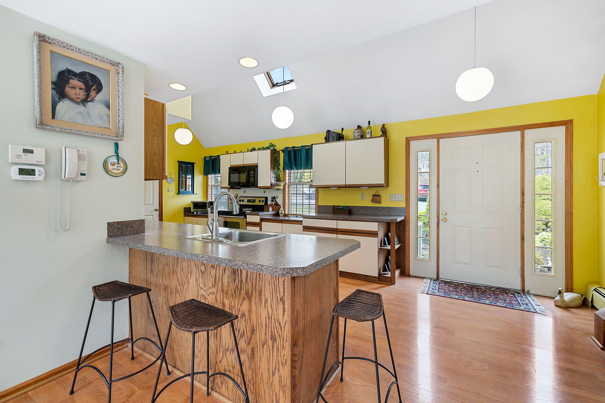 5 Vista Circle Centerville, MA 02632 - Photo 7 of 43 a kitchen with a sink cabinets and window