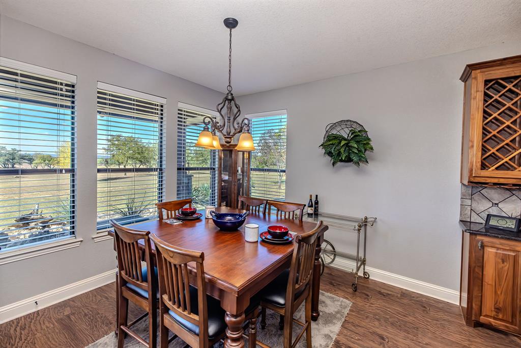 401 Frog Branch Court Graford, TX 76449 - Photo 12 of 40 a view of a dining room with furniture window and outside view