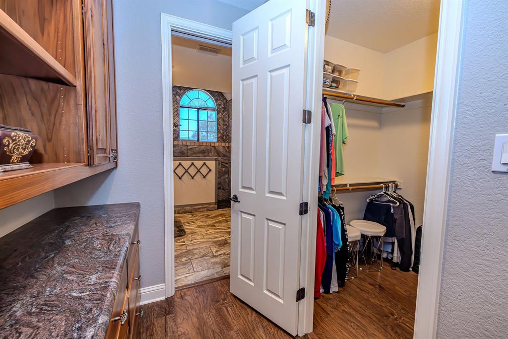 401 Frog Branch Court Graford, TX 76449 - Photo 24 of 40 a view of hallway with wooden floor and furniture