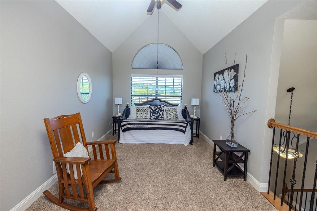 401 Frog Branch Court Graford, TX 76449 - Photo 30 of 40 a living room with furniture a window and a chandelier