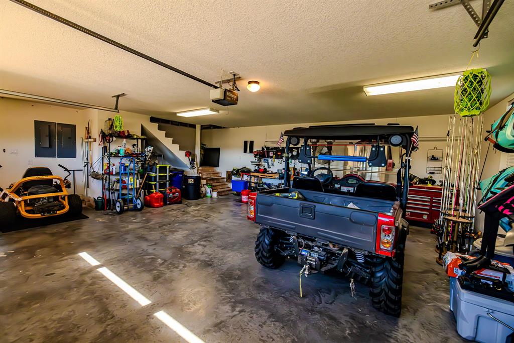 401 Frog Branch Court Graford, TX 76449 - Photo 36 of 40 a room with lots of furniture and a wooden floor