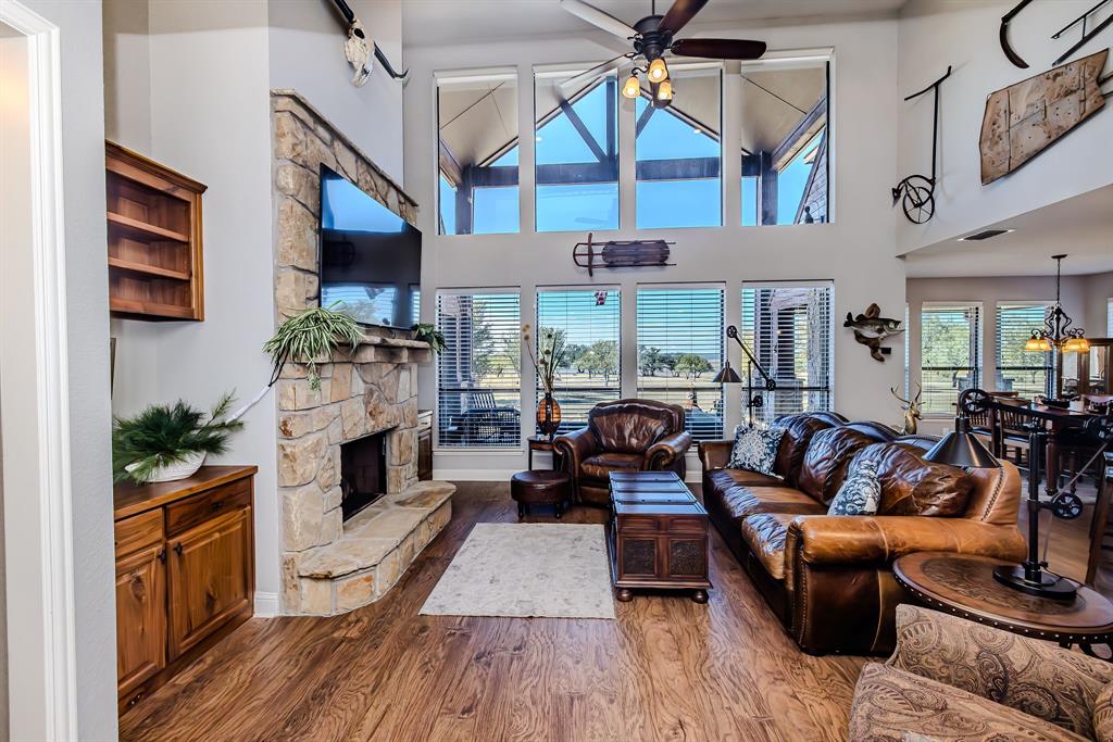 401 Frog Branch Court Graford, TX 76449 - Photo 6 of 40 a living room with fireplace furniture and a flat screen tv
