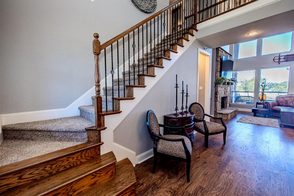 401 Frog Branch Court Graford, TX 76449 - Photo 9 of 40 a living room with wooden floor and a rug
