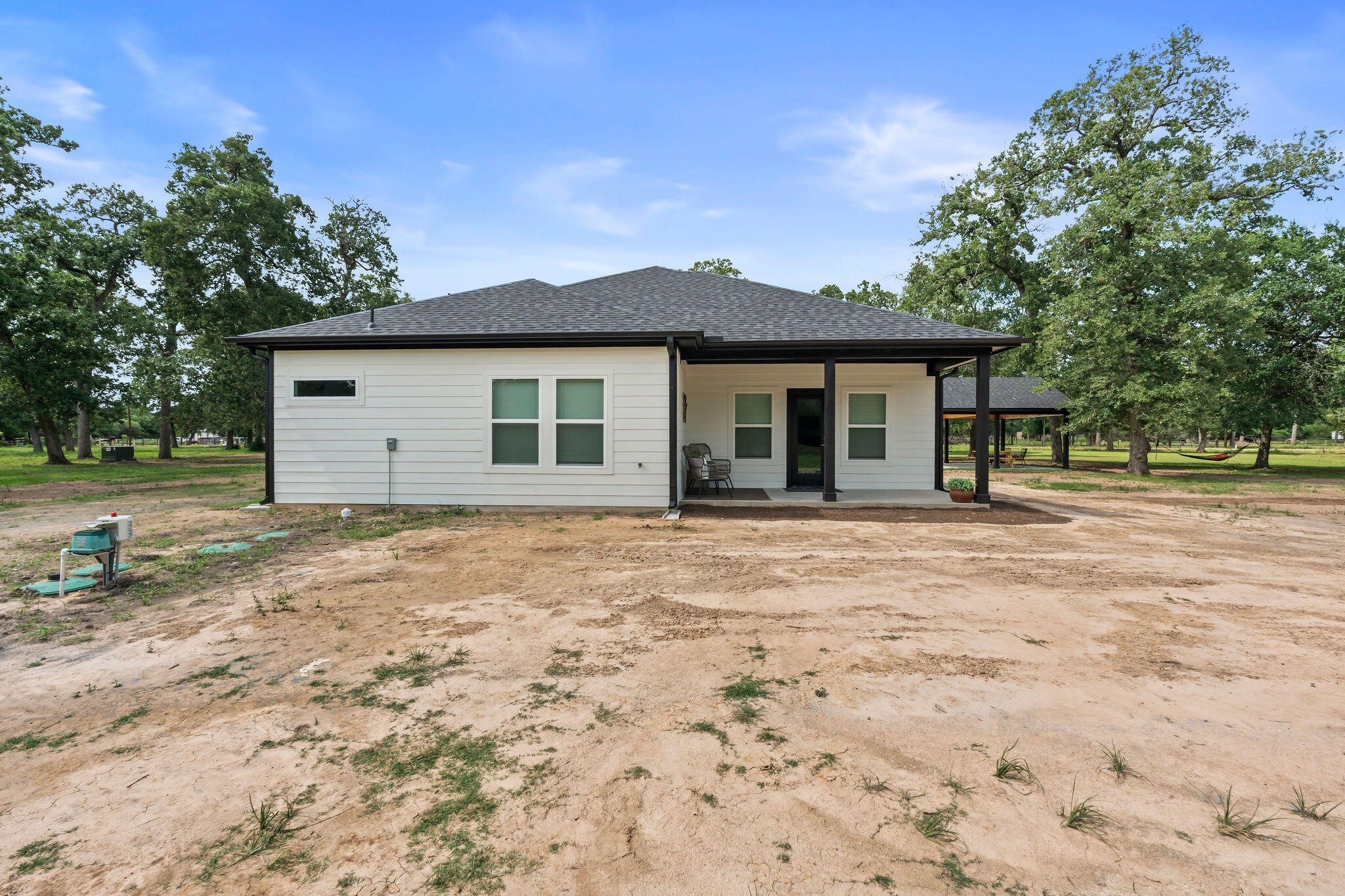 39645 Bosque Road Hempstead, TX 77445 - Photo 33 of 37 a view of a house with a yard