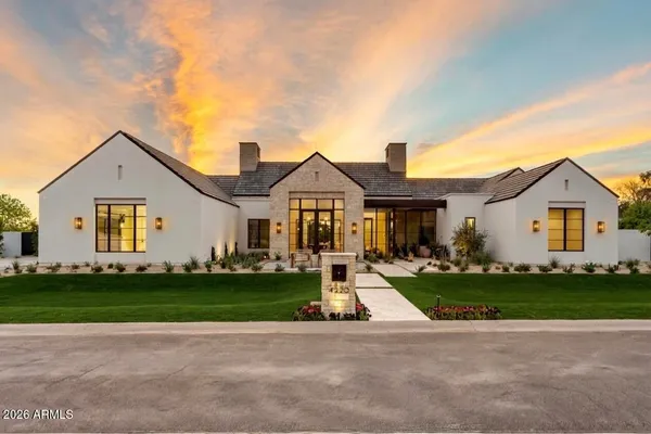 a front view of house with yard and green space