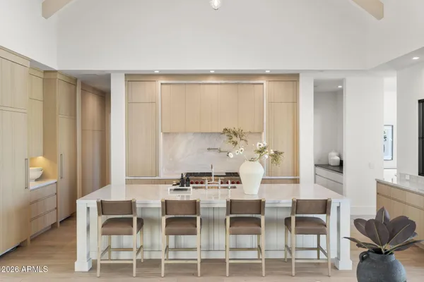 a kitchen with granite countertop a stove and a sink