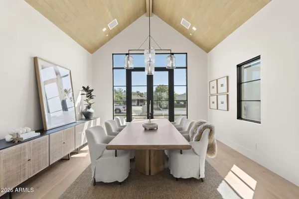 a dining room with wooden floor and breakfast area