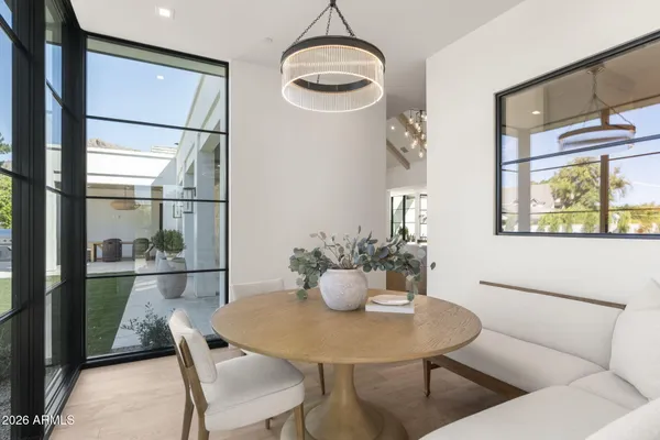 a view of a dining room with furniture window and outside view