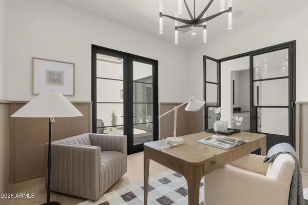 a large white kitchen with stainless steel appliances