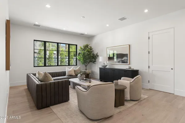 a living room with furniture and a table