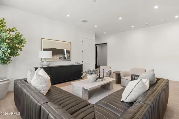 a living room with furniture and a large window