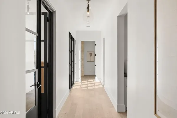 a bathroom with a tub shower and sink