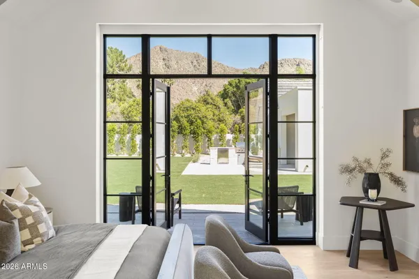a view of a hallway with a wooden door