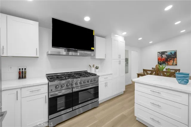 a kitchen with a stove and a microwave