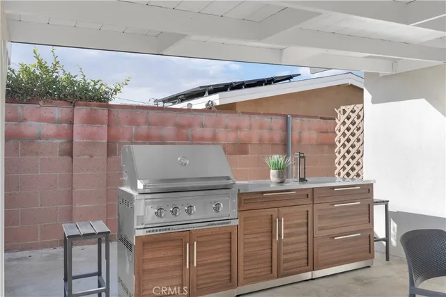 a kitchen with a stove and cabinets