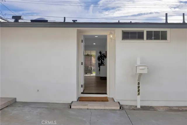 a view of a hallway with a room