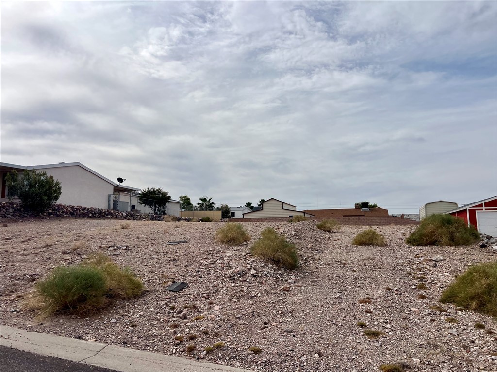 3370 Ridge View Avenue Bullhead City, AZ 86429 - Photo 4 of 10 a view of dirt yard and mountain