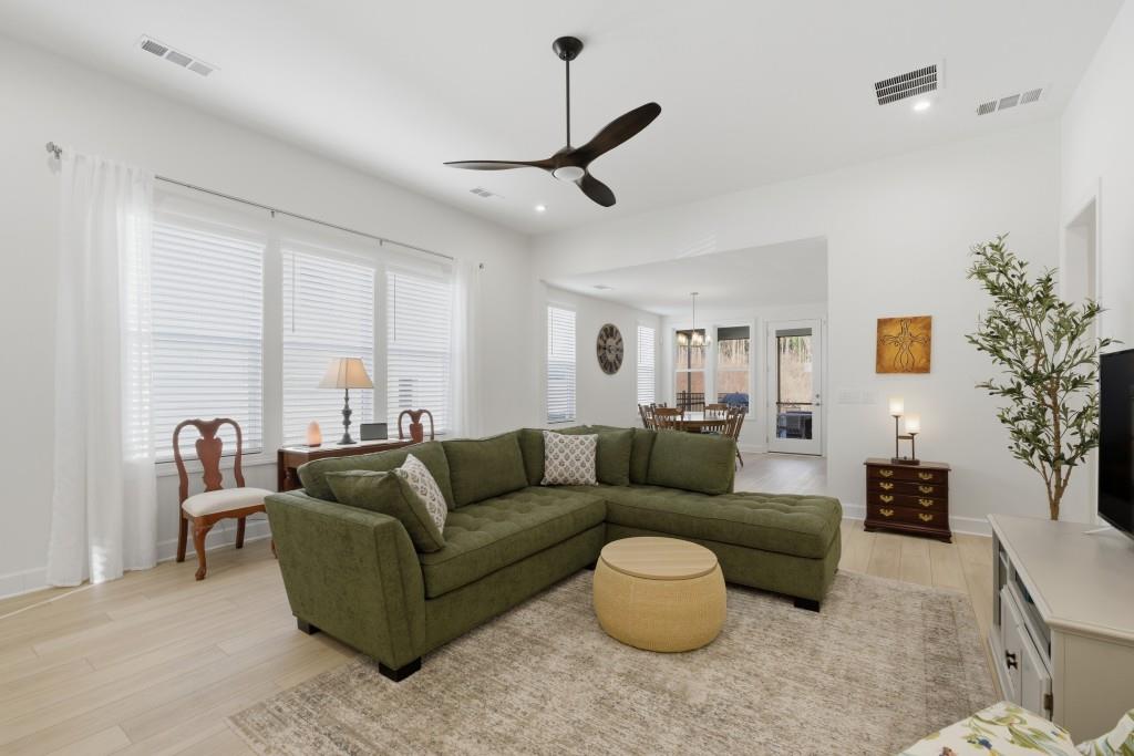 226 Geneva Way Hoschton, GA 30548 - Photo 11 of 84 a living room with furniture and a large window