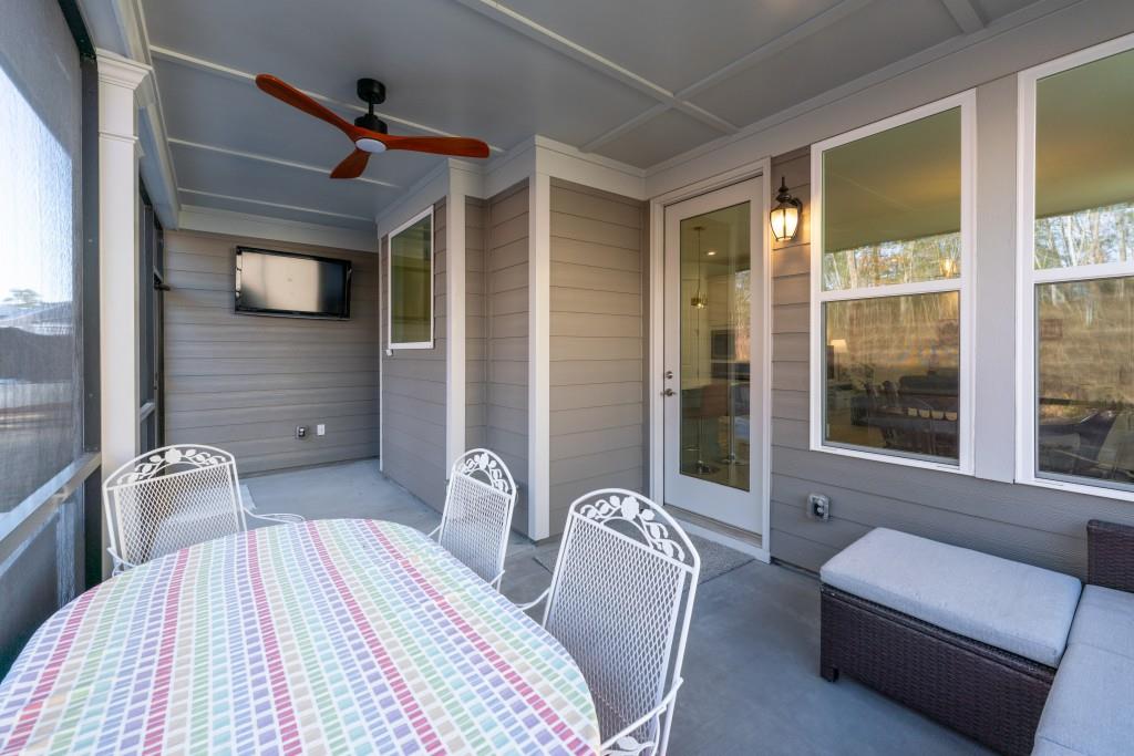 226 Geneva Way Hoschton, GA 30548 - Photo 15 of 84 a bedroom with a bed and a window