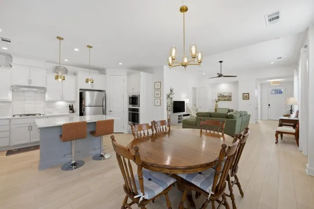 a view of a livingroom with furniture and a flat screen tv