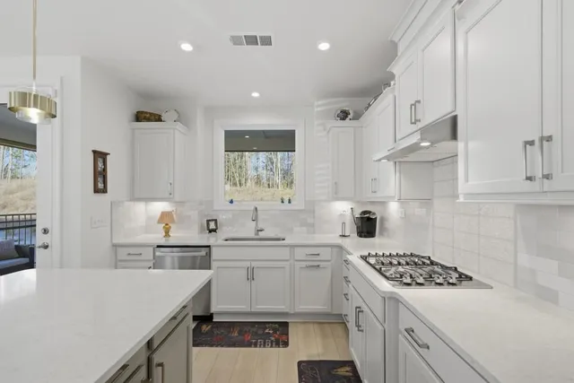 a spacious bathroom with a double vanity sink mirror and double