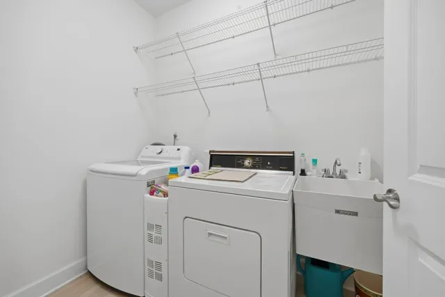 an aerial view of a house with a big yard