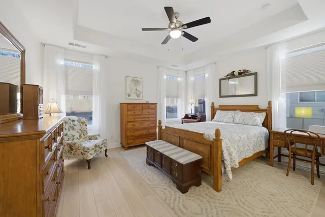 a view of a house with pool and chairs