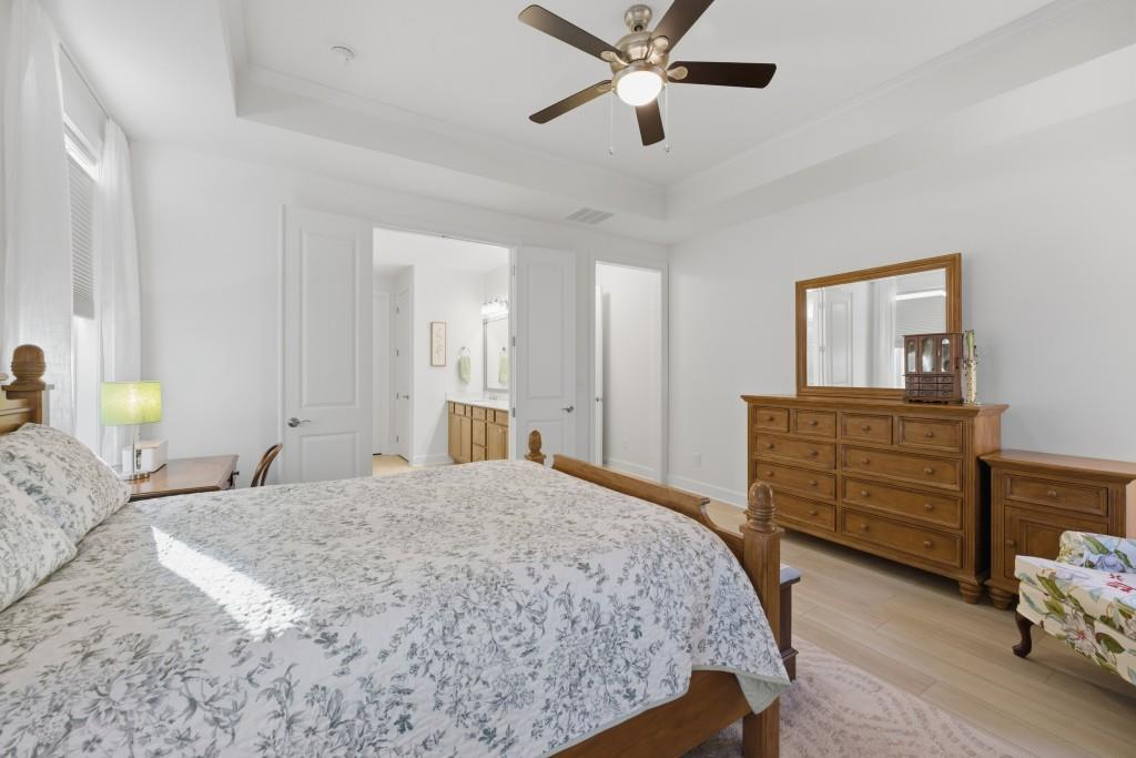 226 Geneva Way Hoschton, GA 30548 - Photo 28 of 84 a bedroom with a bed and wooden floor