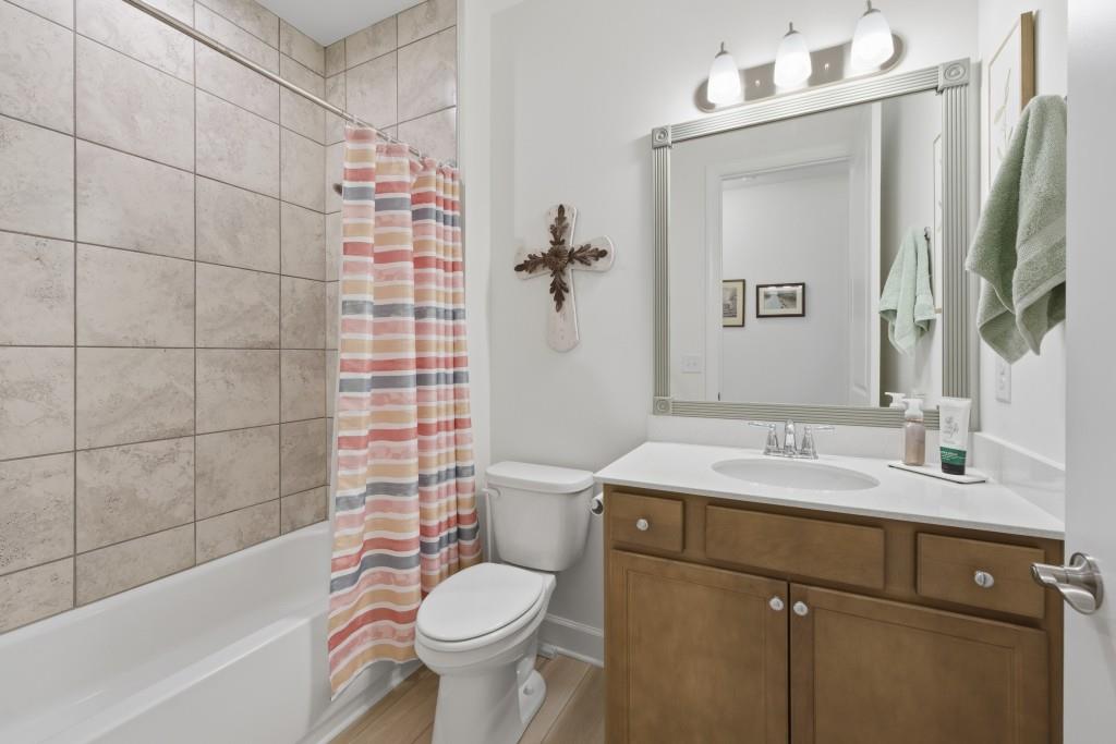226 Geneva Way Hoschton, GA 30548 - Photo 34 of 84 a bathroom with a sink toilet and shower