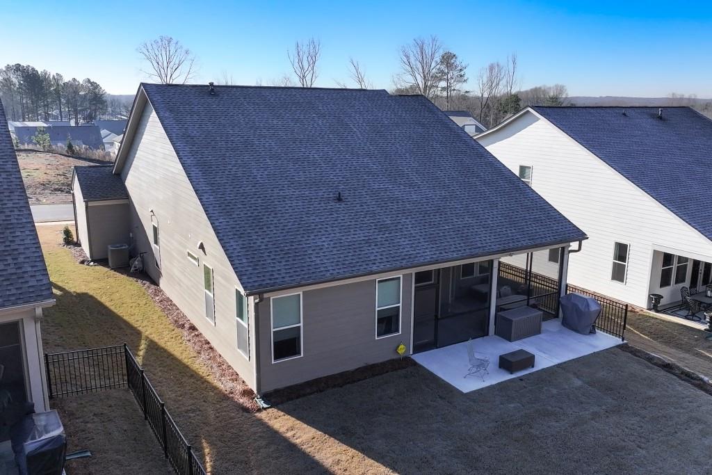226 Geneva Way Hoschton, GA 30548 - Photo 40 of 84 a terrace of a house with wooden floor and fence
