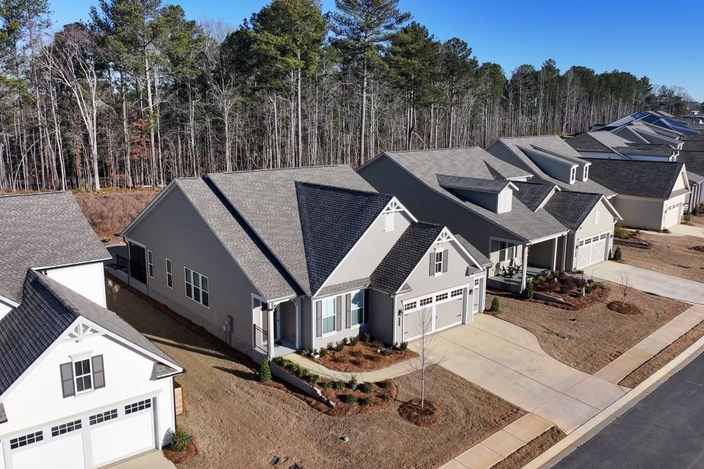 226 Geneva Way Hoschton, GA 30548 - Photo 41 of 84 an aerial view of a house with a big yard