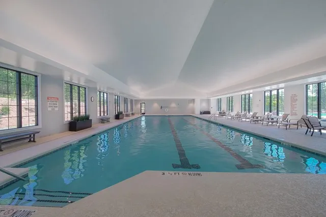 a view of swimming pool with outdoor seating