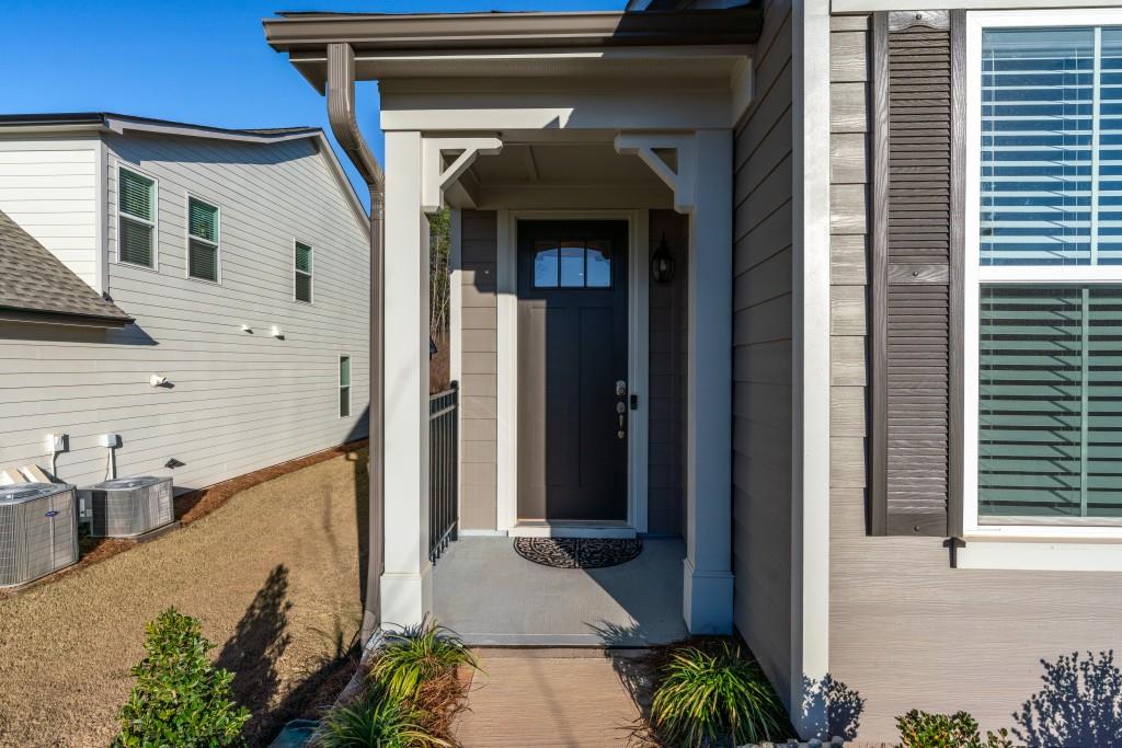 226 Geneva Way Hoschton, GA 30548 - Photo 5 of 84 a view of a balcony with potted plants