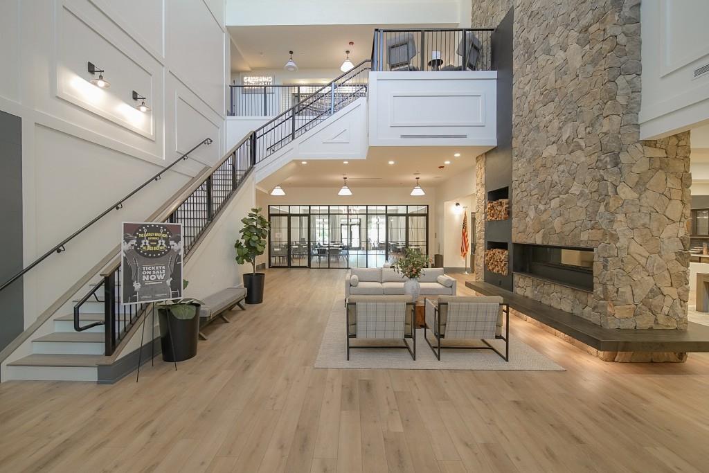 226 Geneva Way Hoschton, GA 30548 - Photo 71 of 84 a living room with furniture and a fireplace
